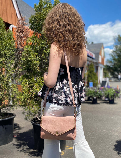 Aria Envelope Crossbody in Dusty Pink  with Studs on  model